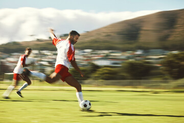 Energy, fitness and soccer training with soccer playing in power kick with ball on a soccer field...