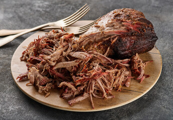 Traditional barbecue pulled pork. Slow cooked pulled pork shoulder. Juicy pork meat cooked in a...