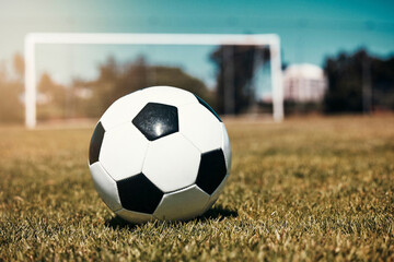 Sports, soccer ball and soccer field for training, fitness and kick practice exercise, wellness and...