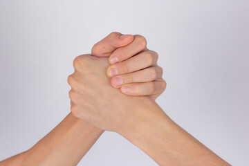 strong male handshake with bare hands on a white background