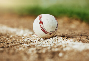 Baseball, sports and sport field on grass in nature on a outdoor training court. White ball on the ground for exercise, cardio training and fitness workout of player and athlete team game on a field