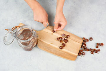Preparing chestnut liquid soap, cutting buckeye and putting it into a jar with water, alternative...