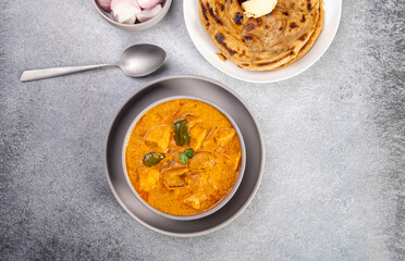 Kadai Paneer is a spicy, flavourful and delicious gravy dish made with  paneer, bell pepper, and onion in a freshly ground spice and served with chappati or lachcha parantha