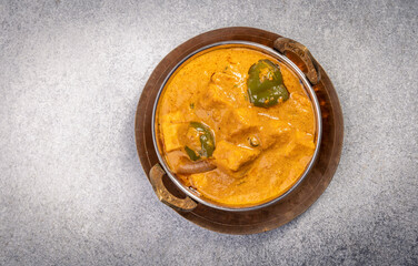 Kadai Paneer is a spicy, flavourful and delicious gravy dish made with  paneer, bell pepper, and onion in freshly ground spices and served in a bowl 