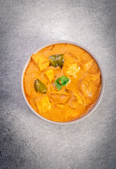 Kadai Paneer is a spicy, flavourful and delicious gravy dish made with  paneer, bell pepper, and onion in freshly ground spices and served in a bowl 