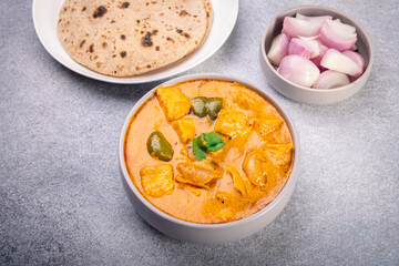 Kadai Paneer is a spicy, flavourful and delicious gravy dish made with  paneer, bell pepper, and onion in a freshly ground spice and served with chappati or lachcha parantha
