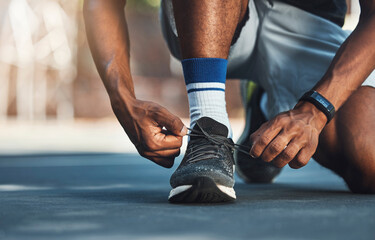 Fitness, hands or black man tie shoes lace before start of running exercise, fitness training or...