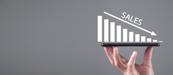 Man showing Sales graph. Economic downfall. Crisis