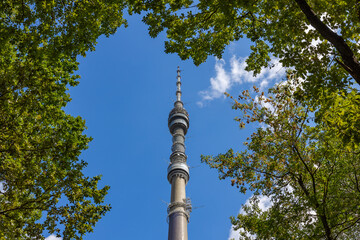 Russia, Moscow, Ostankino TV tower in the crown of trees.