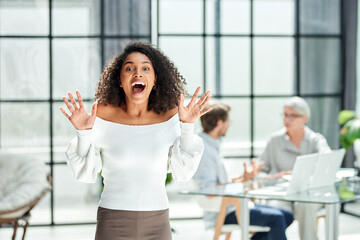 surprised business woman standing in the office .