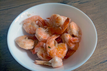 Cooked delicious shrimp in a white plate.