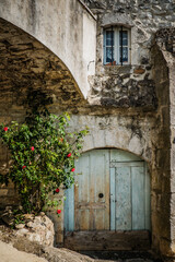 Fototapeta na wymiar The narrow cobblestone street of the medieval village of Balazuc in the South of France (Ardeche)