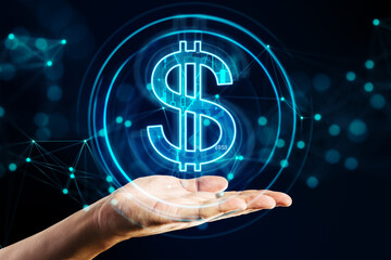 Close up of male hand holding creative glowing dollar hologram on dark backround. Futuristic...