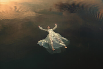 Dead maiden floating in lake waters - 539405904