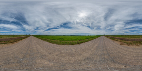 full seamless spherical hdri 360 panorama view on no traffic gravel road among fields with overcast...