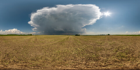 full seamless 360 hdri panorama view among farming fields with storm cloud in overcast sky in equirectangular spherical projection, ready for VR AR virtual reality content
