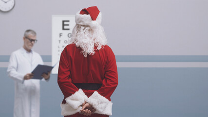 Santa Claus having an eye exam