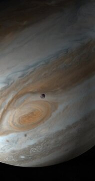 Jupiter planet and satellite Ganymede in rotation in the outer space. 4K Vertical