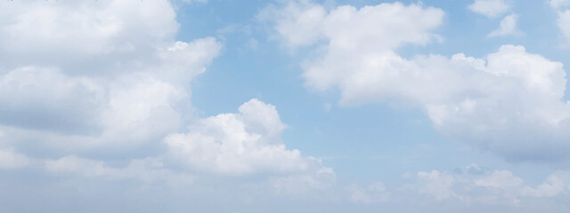 Obraz premium Beautiful blue sky and white clouds of various shapes with sunlight. Nature background