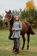 Woman on a horse at rancho. Horse riding, hobby time. Concept of animals and human