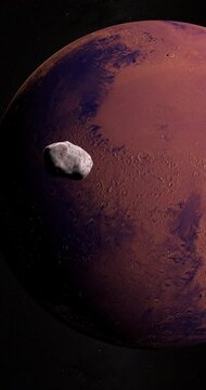 Satellite Phobos, Mars I, orbiting around Mars planet. 4K Vertical