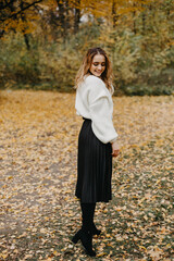 Woman walking in the autumn park, a healthy lifestyle, walk, exercise
