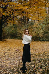 Woman walking in the autumn park, a healthy lifestyle, walk, exercise