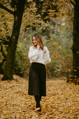 Woman walking in the autumn park, a healthy lifestyle, walk, exercise