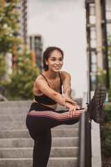 Cute dark-haired young girl exercising outside