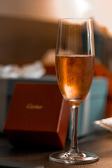 Glass of champagne in hotel. Space for text