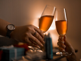 Close up cropped photo of female, male hold in hands glass of champagne