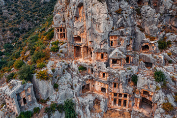 Aerial Top view Ancient lycian rock tomb ruins Myra in Demre Antalya, Turkey. Old tombs and...
