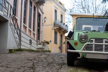 Fototapeta na wymiar retro house and vintage car on city street in Athens Greece