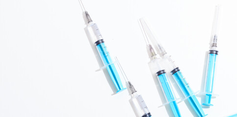 Fototapeta premium Disposable plastic syringe prepared for injection and vaccination in the hospital. The concept of medicine and health