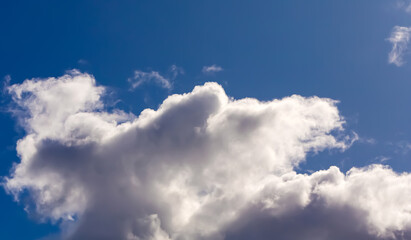 Clouds in dramatic blue sky.