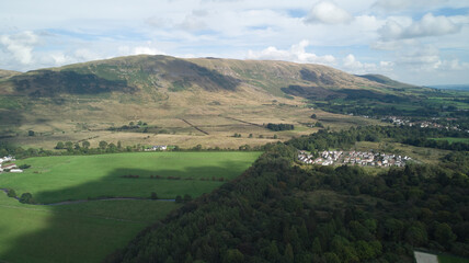 Fototapeta na wymiar Aerial photo of Scottish green fields and hills in summer