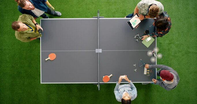Top view, meeting or people with drone technology for product marketing strategy, advertising planning or flight test. Men, women or engineering designer teamwork in project management with prototype