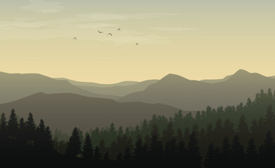 Morning landscape with misty silhouettes of mountains and hills, forest with coniferous trees and flying bird in the yellow toned sky