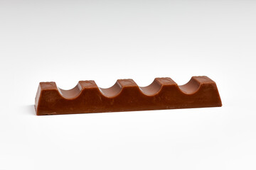 Closeup of chocolate bar isolated on white background