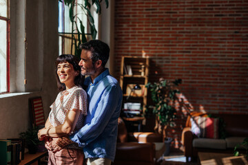 Middle aged couple relaxing at home