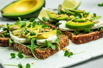 avocado toasts with rye bread, Delicious breakfast or snack, Clean eating, dieting, vegan food concept. top view