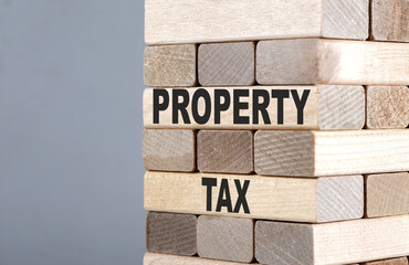 The text on the wooden blocks PROPERTY TAX