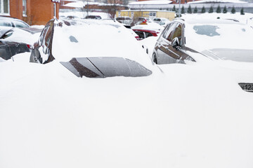 Russia Moscow 13.02.2021 Cars on street covered with snow. City winter collapse, snowfall and snowdrifts. Cars traffic jam. Heavy snowstorm, blizzard. Weather monthly precipitation