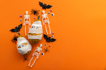 Cute halloween background with mummy pumpkins, skeletons and spiders