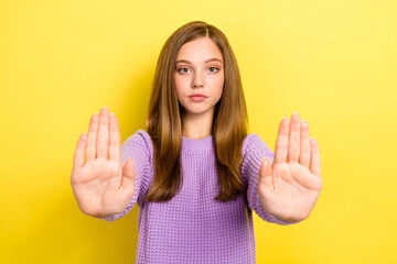 Photo of young serious woman brown long beautiful hair wear comfortable sweater showing stop sign...