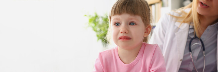Girl cry at doctor office on consultation, upset little girl dont like hospital