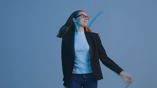 Tired female office employee looking through documents on the go, throw away papers, takes off suit jacket, walking