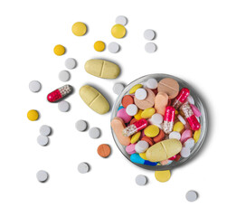 Medicine pills, tablets and capsules on glass bowl