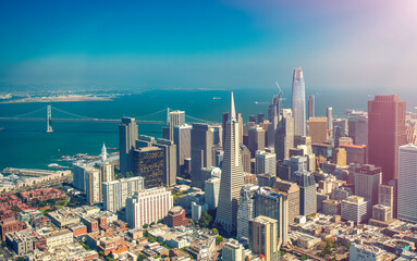 Obraz premium Aerial view of Downtown San Francisco and Bay Bridge from helicopter, California - USA
