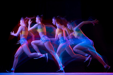 Development of movements. Professional female athlete, runner in motion over dark background in...